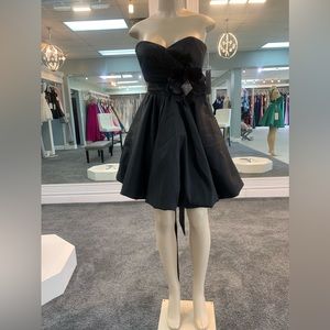 Size 2. black. strapless. cocktail own
